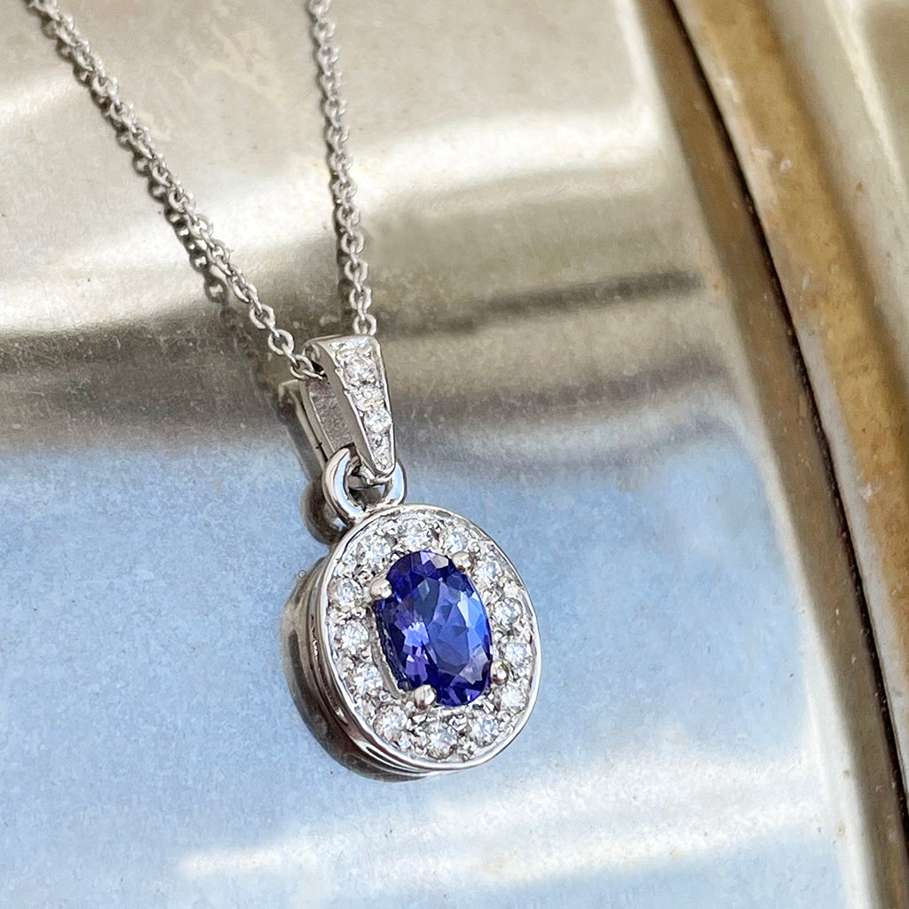 Classically Elegant Oval Tanzanite and Diamond Halo Pendant