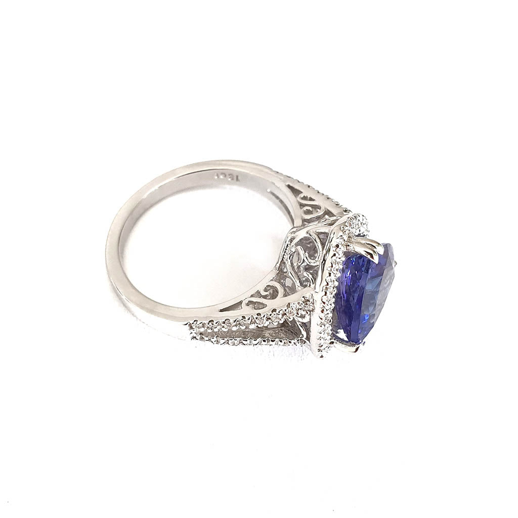 Double Diamond Shoulder Trilliant Cut Tanzanite and Diamond Halo Ring