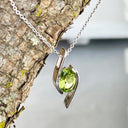 Dynamic White Gold Twisted Oval Cut Peridot Pendant