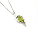 Dynamic White Gold Twisted Oval Cut Peridot Pendant