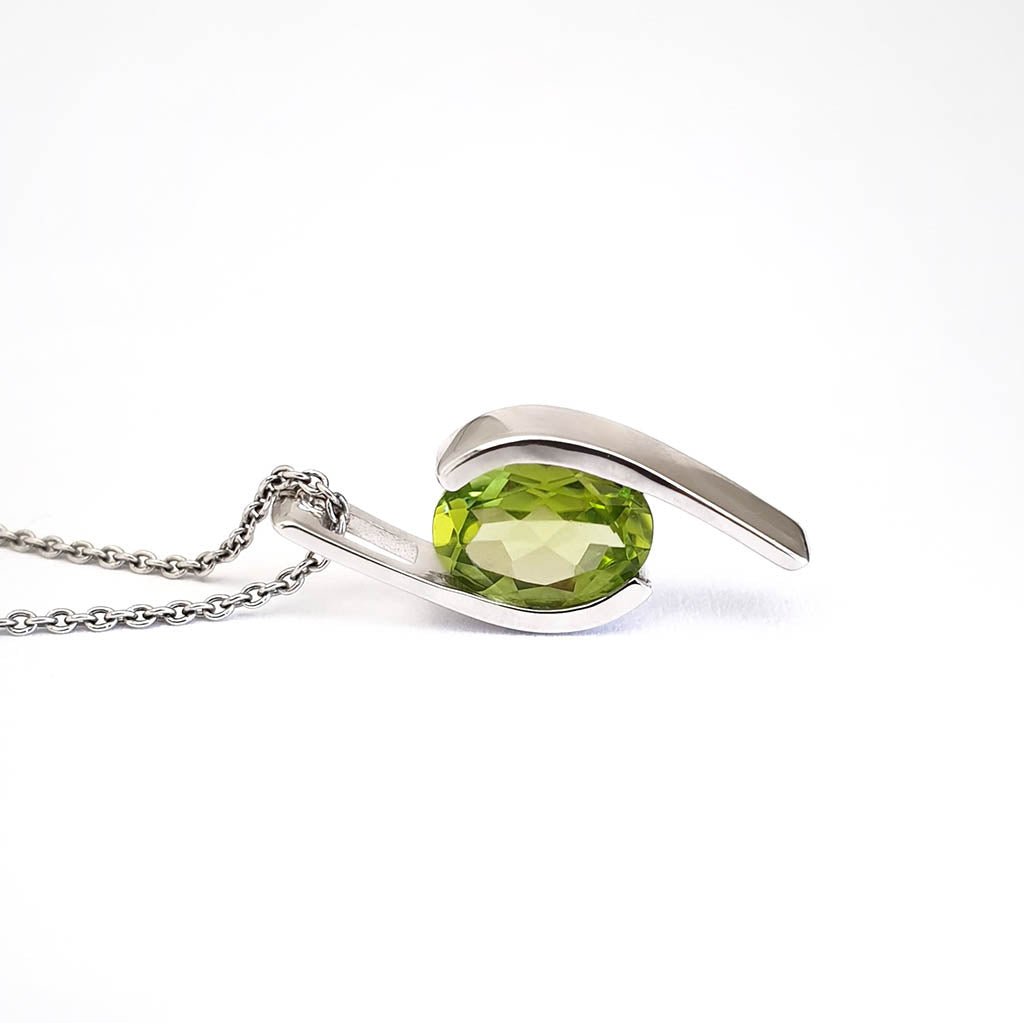 Dynamic White Gold Twisted Oval Cut Peridot Pendant