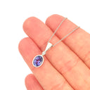 Elegant Tube Set Oval Tanzanite and Diamond White Gold Pendant