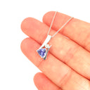 Unique Trilliant Tanzanite and Round Bezel Set Diamond Pendant