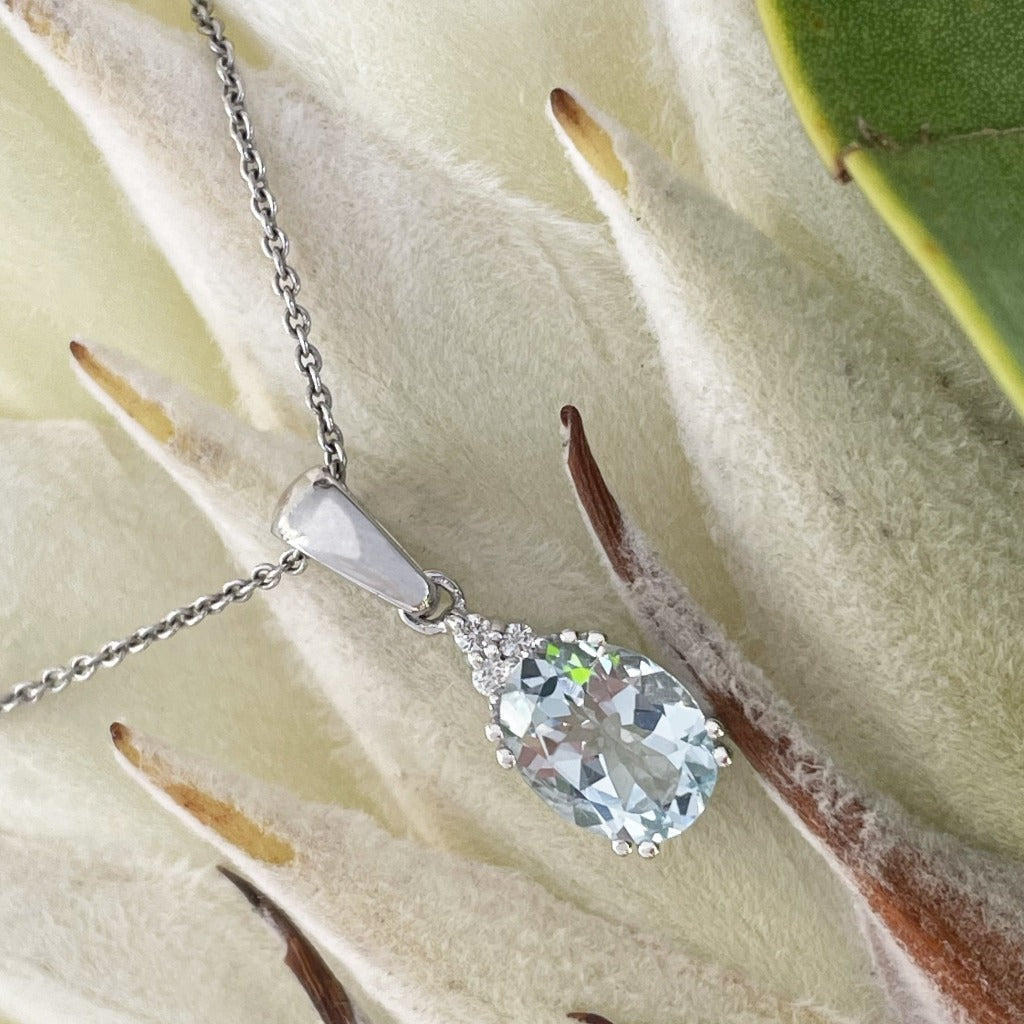 Elegant Oval Cut Aquamarine and Trilogy Diamond Pendant