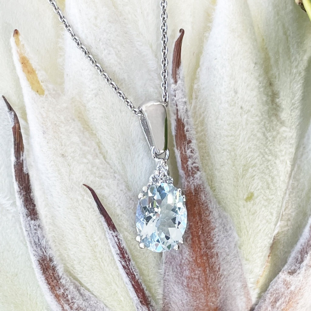 Elegant Oval Cut Aquamarine and Trilogy Diamond Pendant