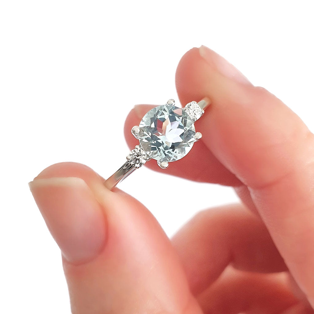 Elegant Round Cut Aquamarine and Accent Diamond Ring