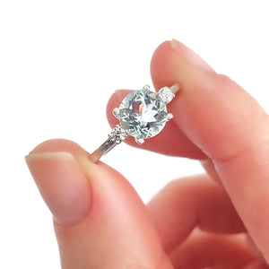 Elegant Round Cut Aquamarine and Accent Diamond Ring