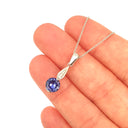 Elegant Round Tanzanite with Diamond Droplet Pendant