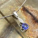 Elegant Round Tanzanite with Diamond Droplet Pendant