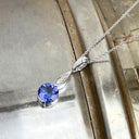 Elegant Round Tanzanite with Diamond Droplet Pendant