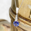 Elegant Round Tanzanite with Diamond Droplet Pendant