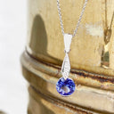 Elegant Round Tanzanite with Diamond Droplet Pendant