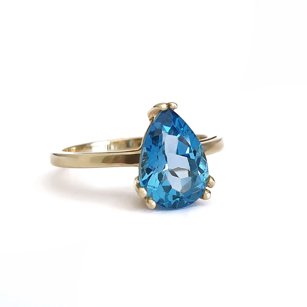Elegant Solitaire Pear Cut London Blue Topaz Yellow Gold Ring