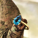 Elegant Solitaire Pear Cut London Blue Topaz Yellow Gold Ring