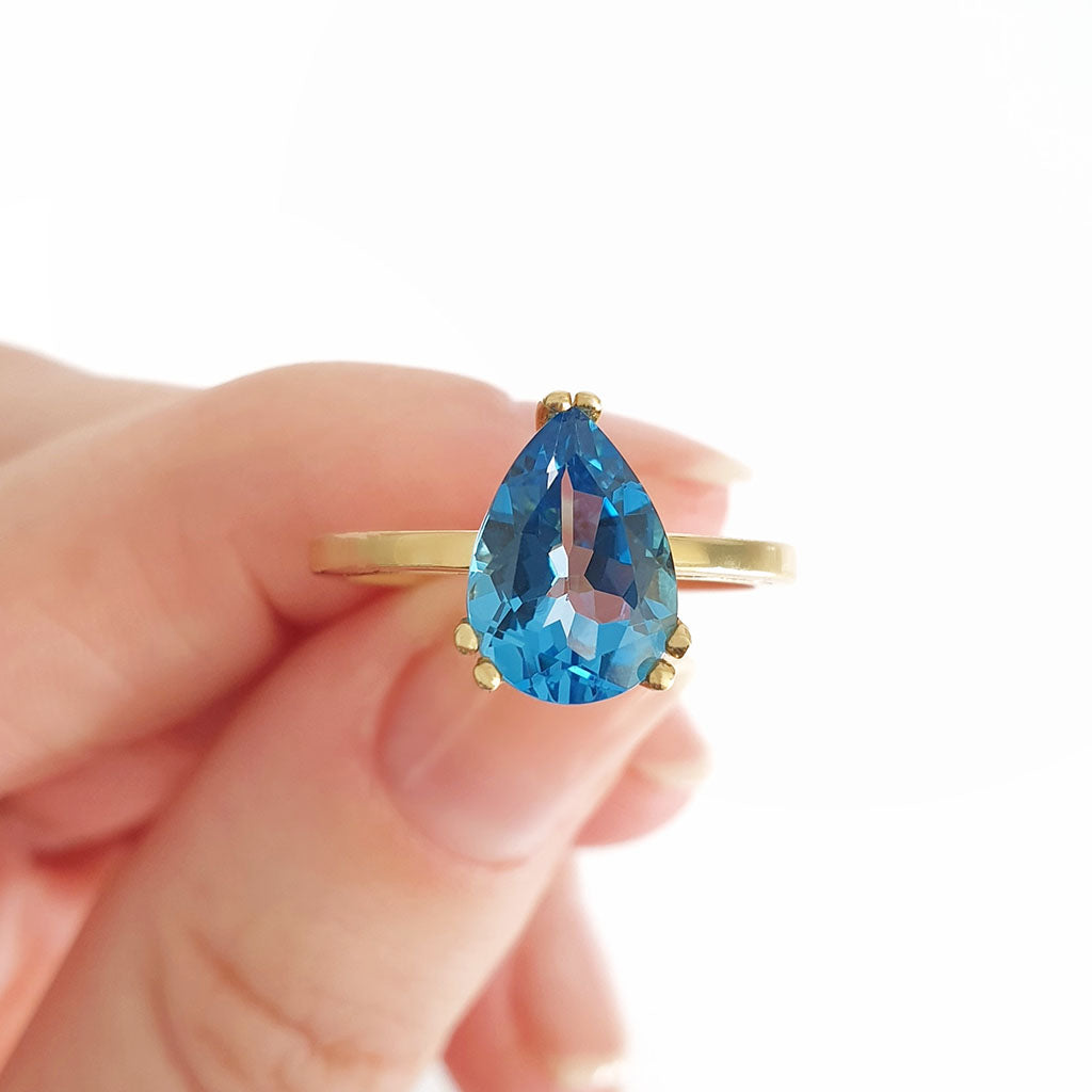 Elegant Solitaire Pear Cut London Blue Topaz Yellow Gold Ring