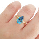 Elegant Solitaire Pear Cut London Blue Topaz Yellow Gold Ring