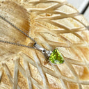 Elegant Trilliant Cut Peridot with Trilogy Diamond Highlight Pendant