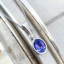 Elegant Tube Set Oval Tanzanite and Diamond White Gold Pendant