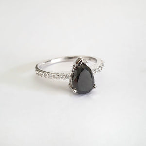Elegant pear cut black diamond with diamond shoulder accented ring