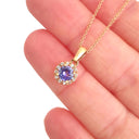Elevated Tanzanite and Diamond Halo Pendant in Rose Gold