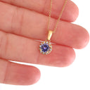 Elevated Tanzanite and Diamond Halo Pendant in Rose Gold