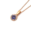 Elevated Tanzanite and Diamond Halo Pendant in Rose Gold