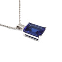 Emerald Cut Tanzanite with Swish Detailed Fixed Bale pendant