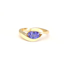 Gently Embraced Oval Tanzanite Yellow Gold Ring