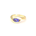 Gently Embraced Oval Tanzanite Yellow Gold Ring