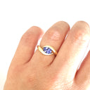 Gently Embraced Oval Tanzanite Yellow Gold Ring
