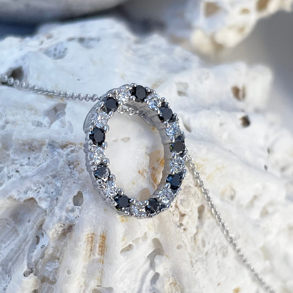 Gorgeous Oval Black and White Diamond Halo Pendant