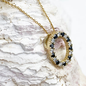 Gorgeous Oval Black and White Diamond Yellow Gold Halo Pendant