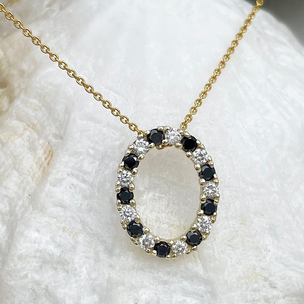 Gorgeous Oval Black and White Diamond Yellow Gold Halo Pendant