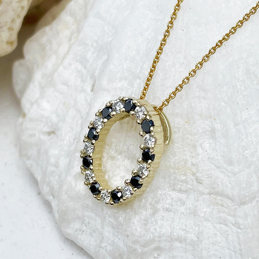 Gorgeous Oval Black and White Diamond Yellow Gold Halo Pendant