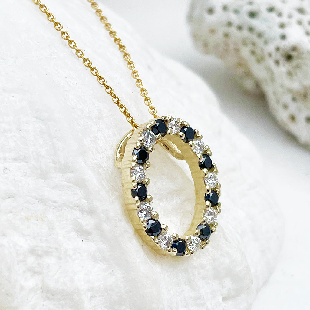 Gorgeous Oval Black and White Diamond Yellow Gold Halo Pendant