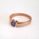 Half Bezel and Open Set Round Cut Tanzanite Ring