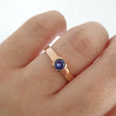 Half Bezel and Open Set Round Cut Tanzanite Ring