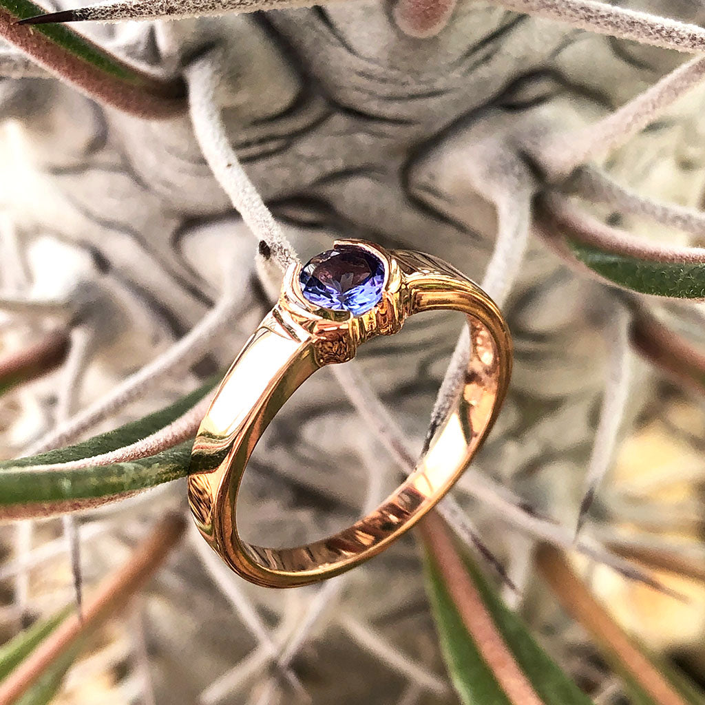 Half Bezel and Open Set Round Cut Tanzanite Ring