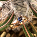 Half Bezel and Open Set Round Cut Tanzanite Ring