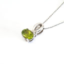 Half Bow Oval Cut Peridot with Diamond Highlight Pendant