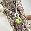 Half Bow Oval Cut Peridot with Diamond Highlight Pendant