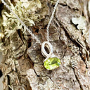 Half Bow Oval Cut Peridot with Diamond Highlight Pendant