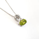 Half Bow Oval Cut Peridot with Diamond Highlight Pendant