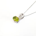  Half Bow Oval Cut Peridot with Diamond Highlight Pendant