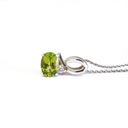 Half Bow Oval Cut Peridot with Diamond Highlight Pendant