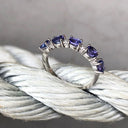 Half Eternity Oval Cut Tanzanite and Diamond Highlight Ring