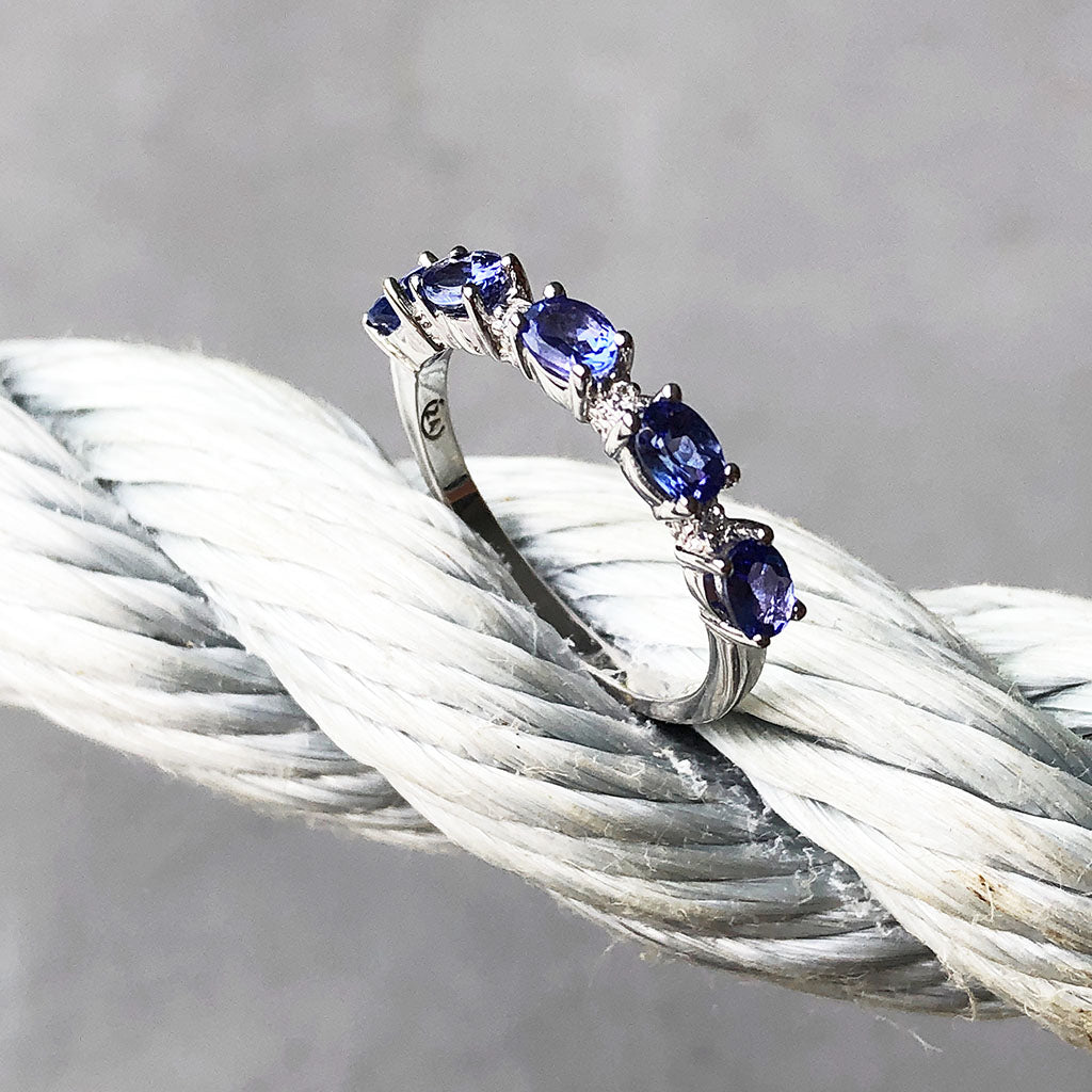 Half Eternity Oval Cut Tanzanite and Diamond Highlight Ring