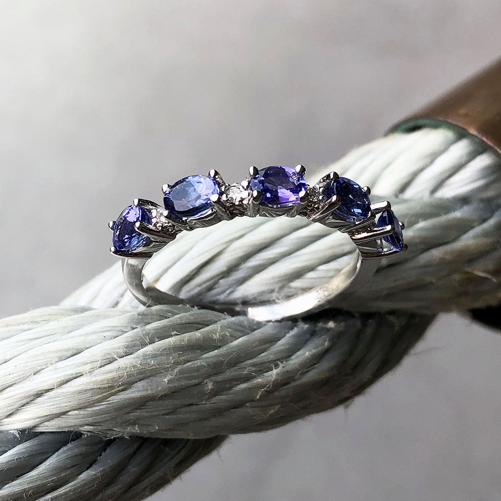 Half Eternity Oval Cut Tanzanite and Diamond Highlight Ring