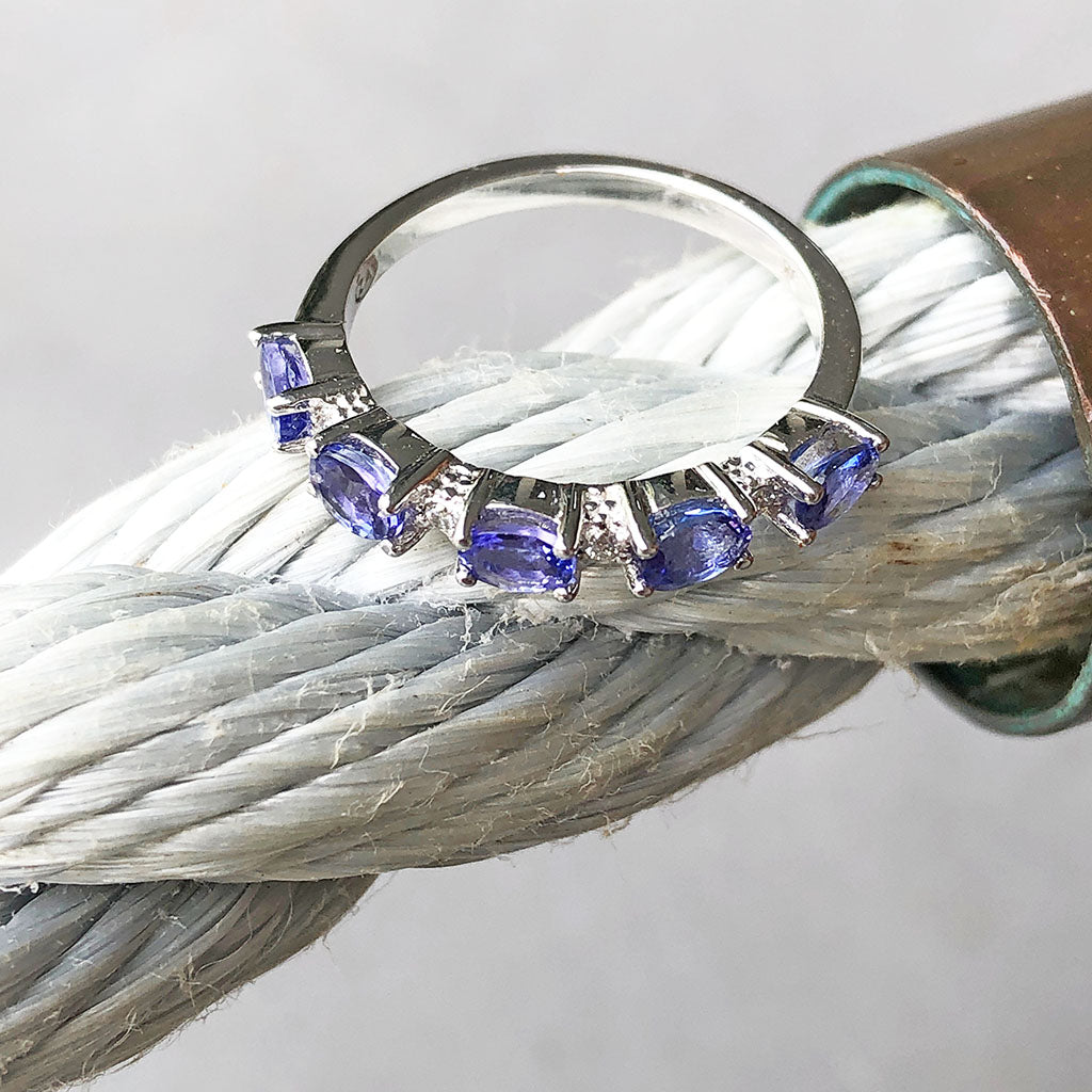 Half Eternity Oval Cut Tanzanite and Diamond Highlight Ring