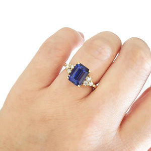 Handcrafted Emerald Cut Tanzanite Ring with Trilogy Diamond Accent
